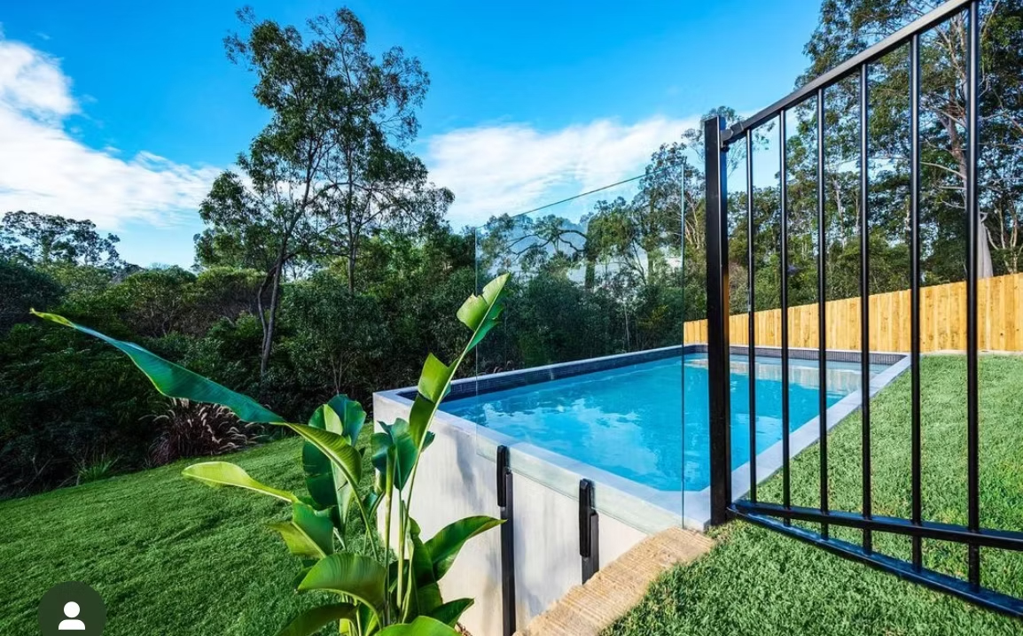 DIPP63 pool surrounded by tropical landscaping